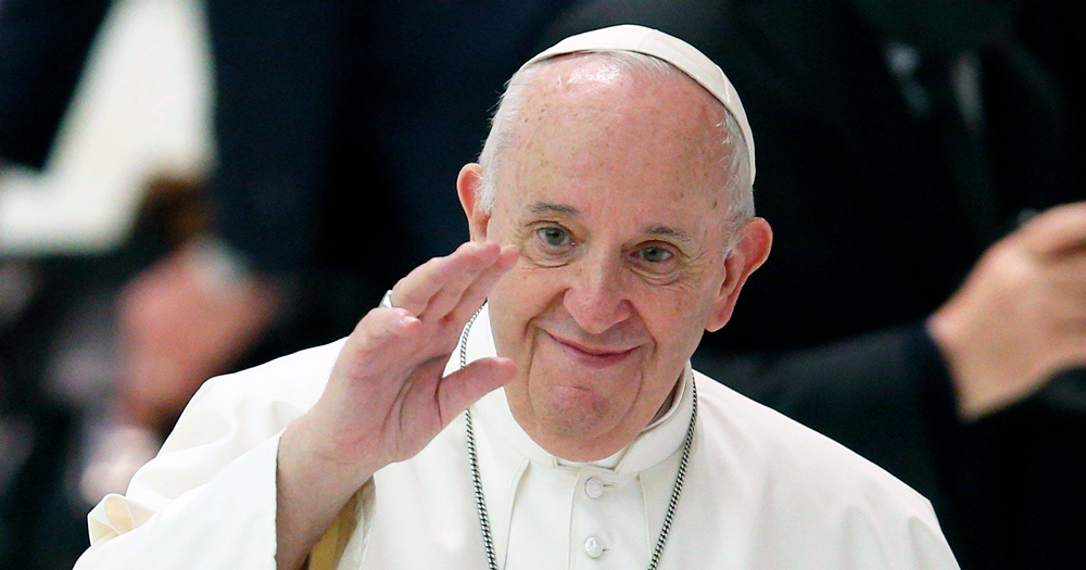 Pope Francis waving. In a recent interview, he declared his support for same sex civil unions