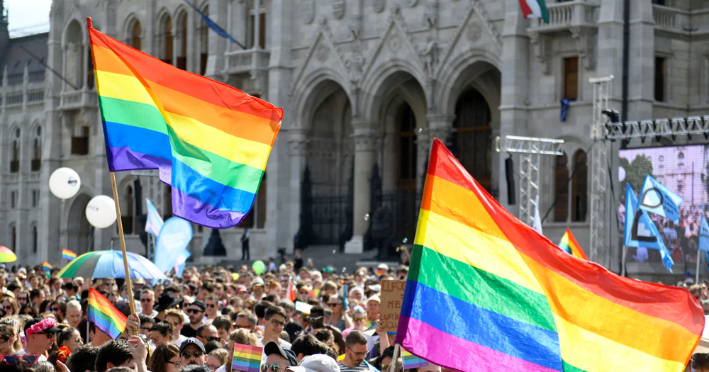 Hungarian Government: rainbow flags waving in a square