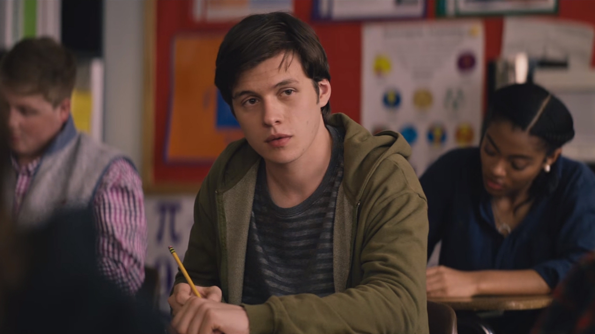 Simon sitting at desk, uplifting queer movies