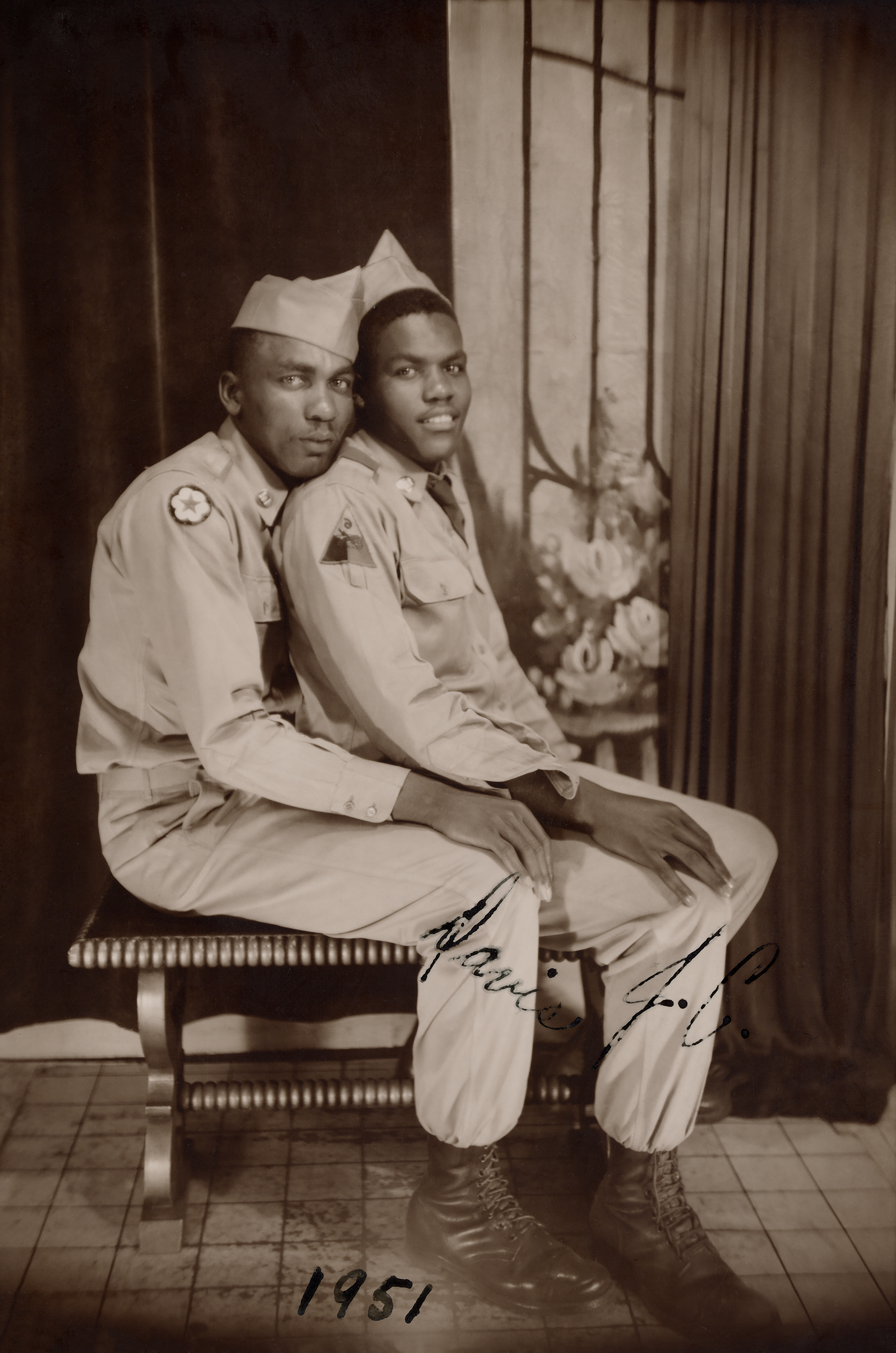 Two soldiers, one sitting on the others lap, Loving, a history of men in love through photographs