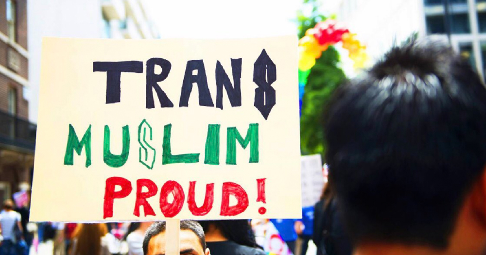 People carrying a banner reading 'trans Muslim and proud'