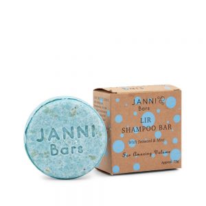 Sustainable stocking fillers: blue shampoo bar next to its cardboard box