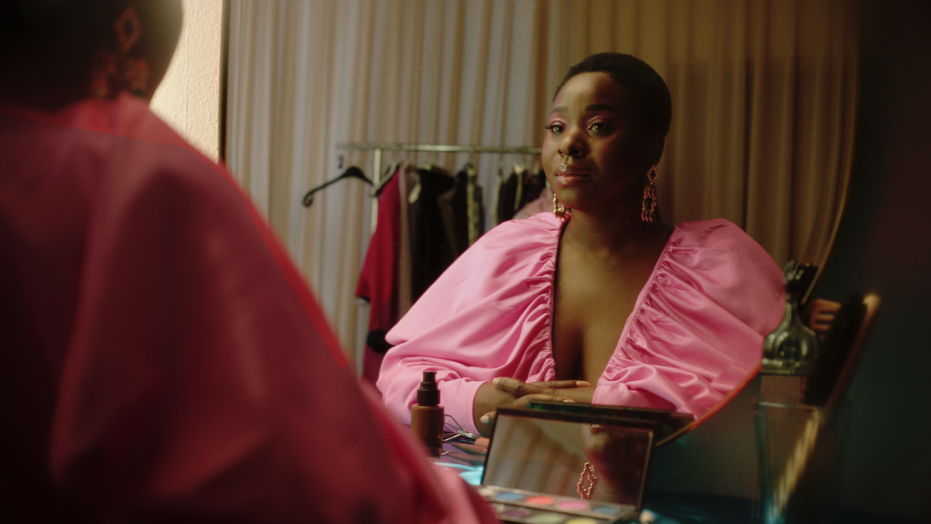 ballroom dancer sitting looking at themselves in the mirror