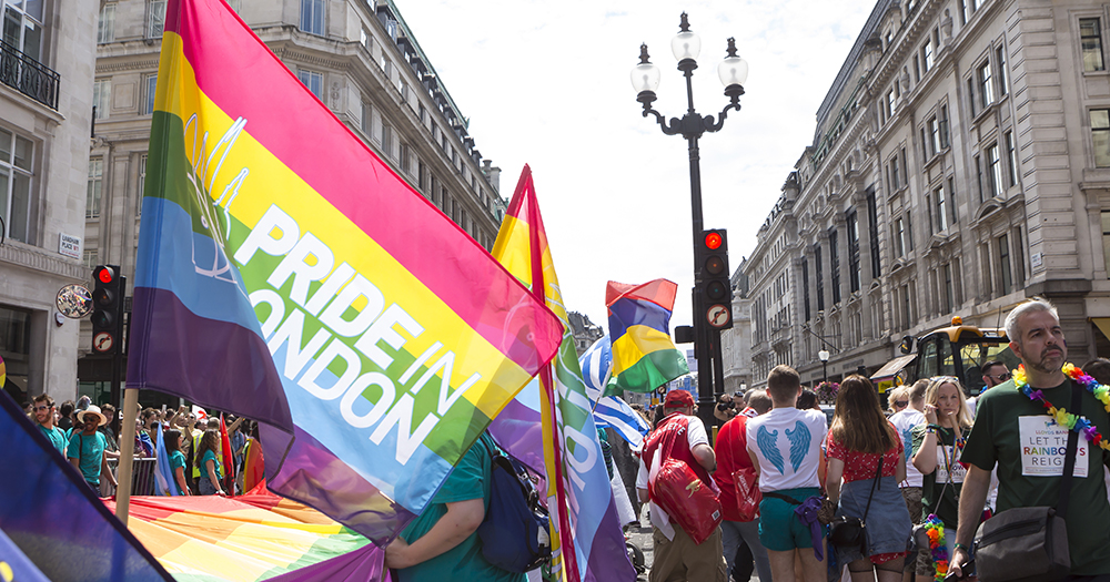 Pride in London event where people hold a massive rainbow