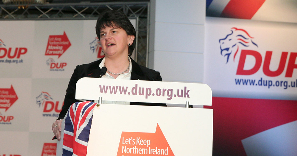 A female politician standing behind a podium