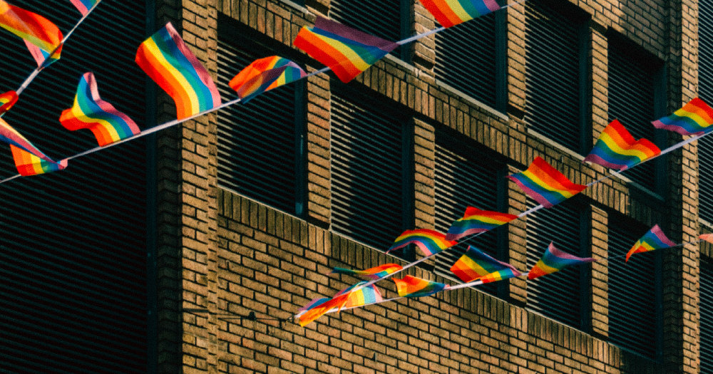 ILGA rainbow Map 2021: picture of rainbow flags flying between buildings