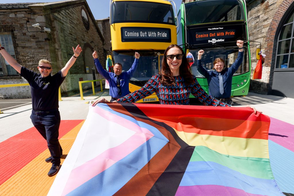 Dublin Bus & GCN press shot: members of Dublin Bus and GCN team pose standing on a rainbow crossing