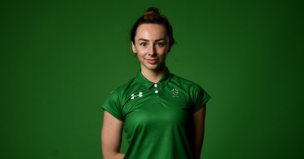 Irish Paralympian Ellen Keane is pictured wearing her Ireland jersey against a green background. Ellen won gold for Ireland at the Tokyo Paralympics.