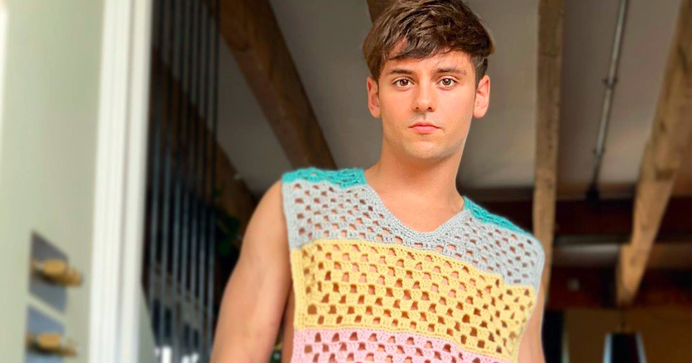 Tom Daley poses in a knitted Jumper of his own making