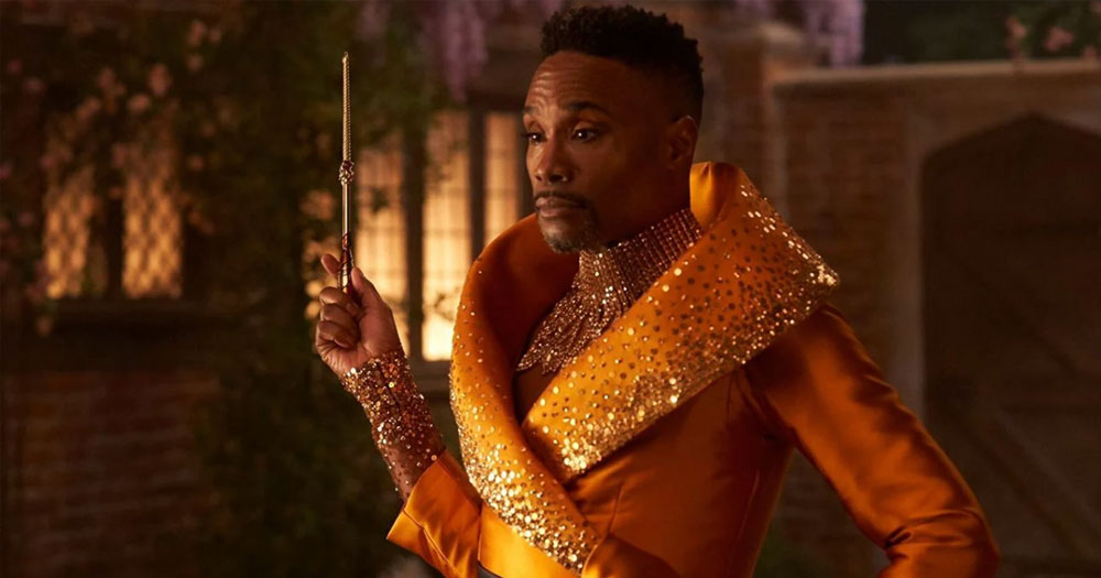 Billy Porter dressed as a fairy godmother holding a wand