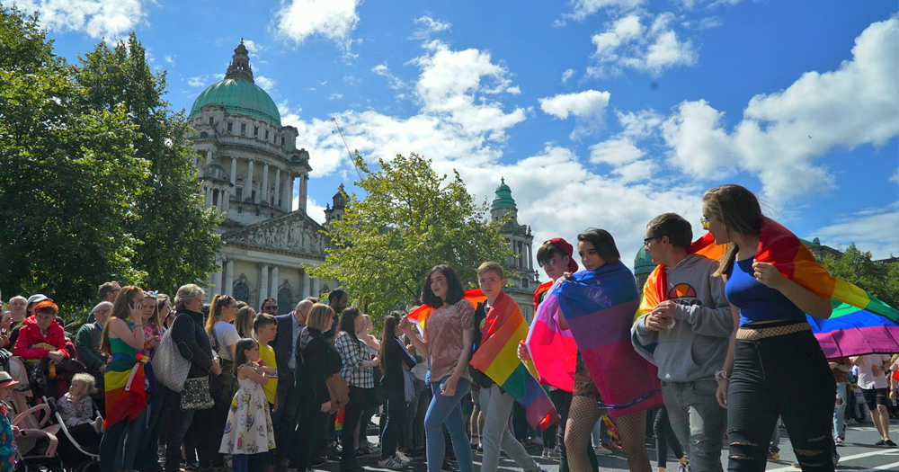 A group of kids wearing rainbow flags during Belfast Pride. Belfast is currently looking at creating an LGBTQ+ hub