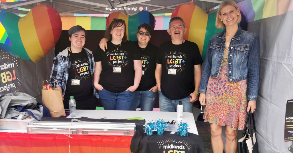 Four members of the Midlands LGBT+ Project pose for a photo with Minister for State Pippa Hackett at their launch event.