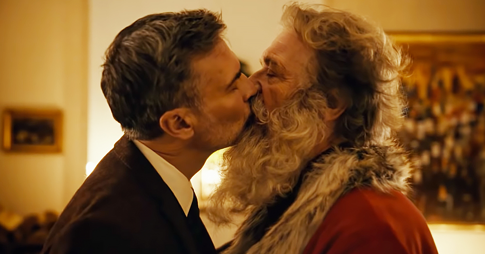 Still from the Norwegian Post Christmas ad, When Harry Met Santa. The photograph shows two men kissing, the man on the right is dressed in a Santa suit.