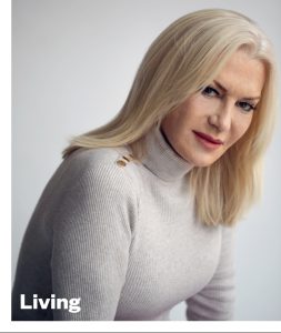 A blonde woman wearing a polo neck jumper as seen of the cover of GCN December 2021 issue
