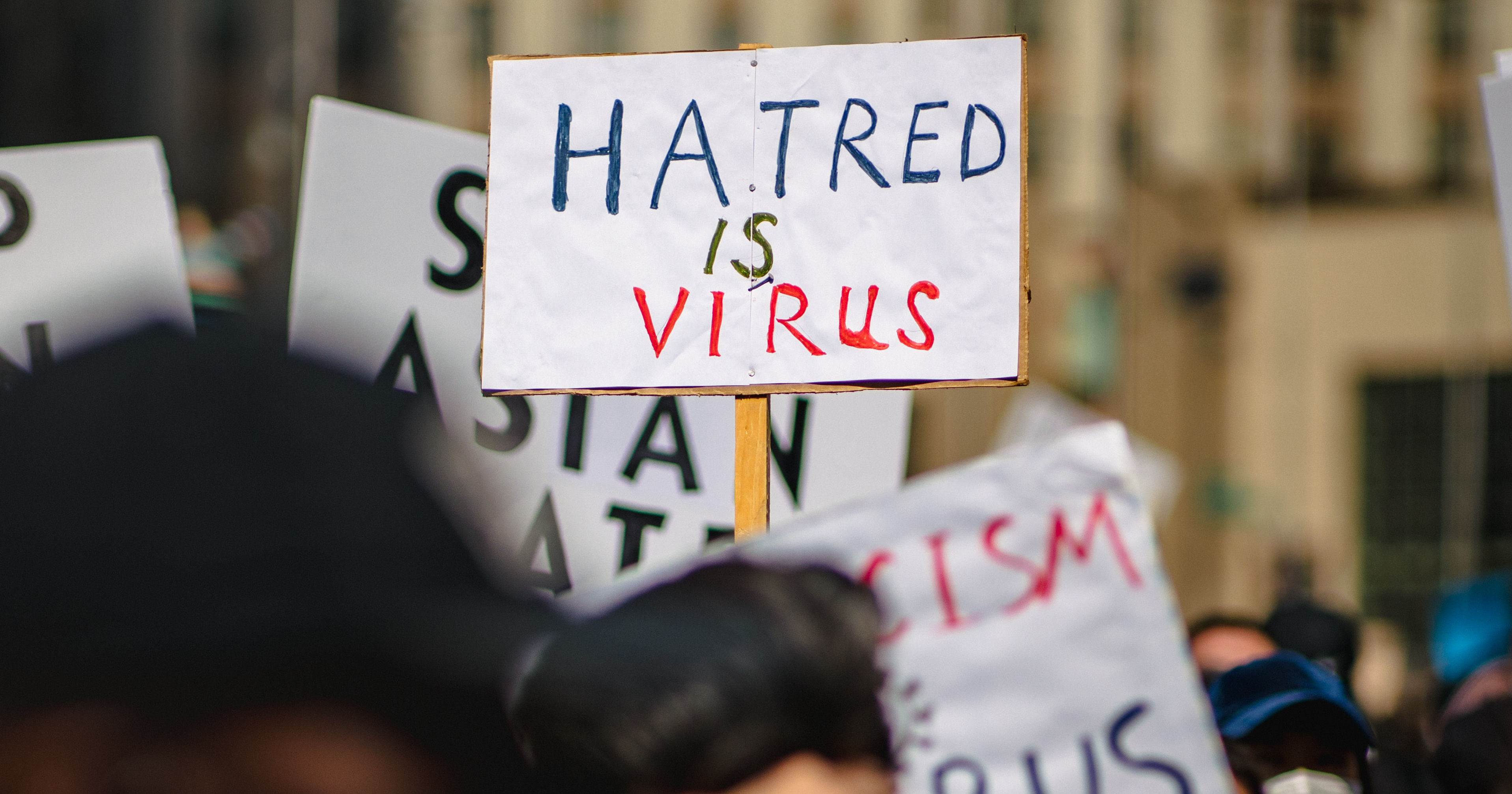 A sign that reads, "HATRED IS VIRUS" as the European Commission work to criminalise hate speech in the EU.