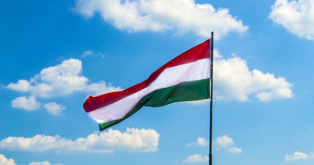 Hungary flag against a blue sky