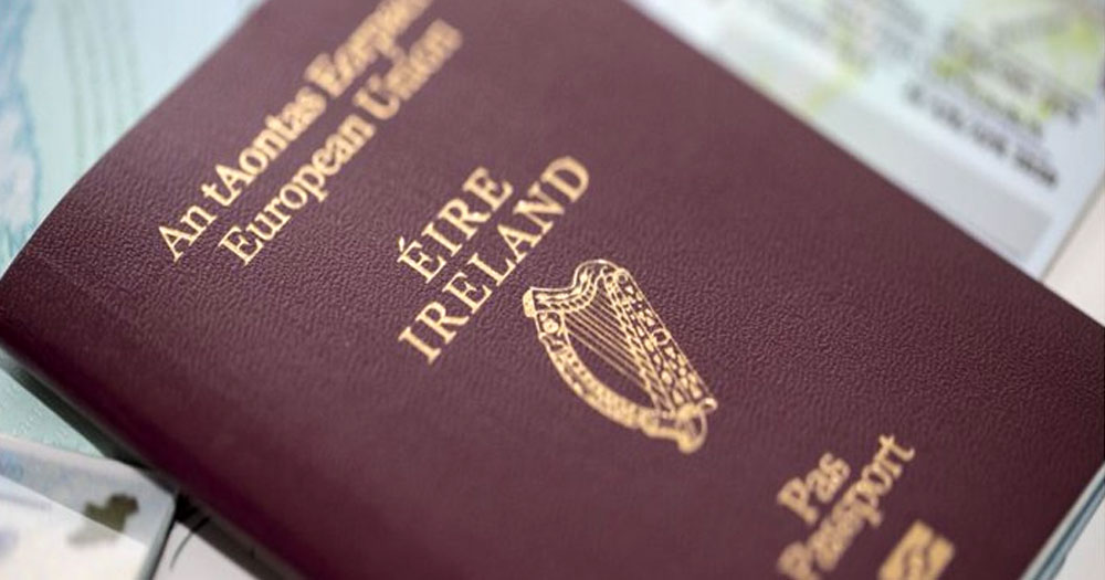 Close-up of Irish passport on pile of documents