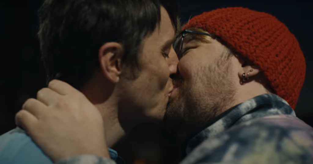 A couple kisses in the Stonewall Christmas campaign video.