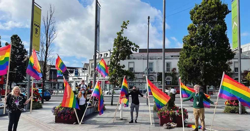 Pride flags and members of the LGBTQ+ community celebrating in Galway city