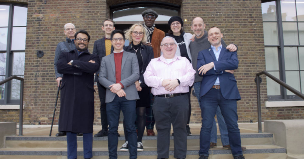 The team of Queer Britain pose for a photo outside the new home of the forthcoming LGBTQ+ museum