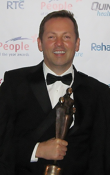 Eoin Collins receiving an award