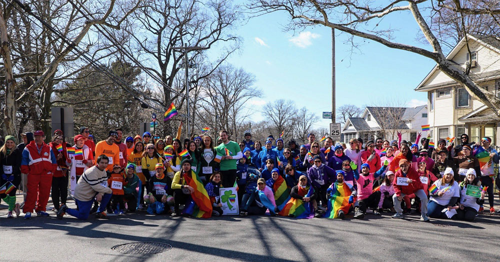 A group of LGBTQ+ people celebrating Staten Island Pride