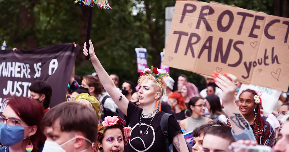 People during a protest carrying a banner that reads ‘Protect Trans Youth'. A Texas Governor has ordered an investigations of parents who support Trans healthcare.