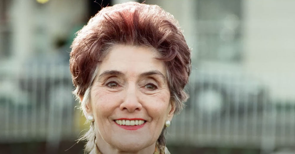 Close up of June Brown smiling and looking off camera