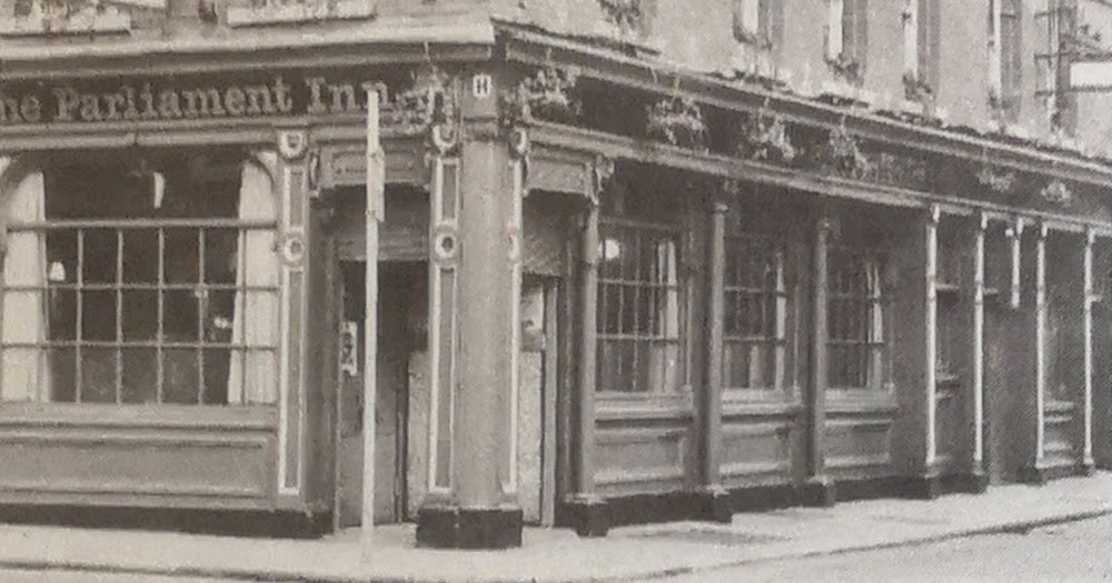 A black and white photograph of the old Parliament Inn, the site of one of the first Lesbian Avengers demonstrations in Dublin.
