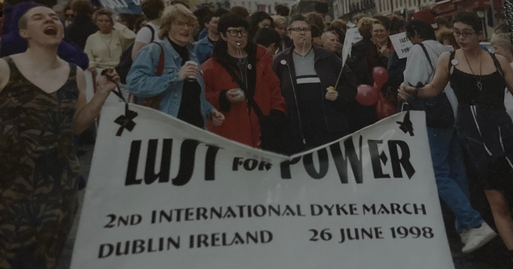 Participants at the second International Dyke March in Dublin hold a banner with the slogan 'Lust for Power'.