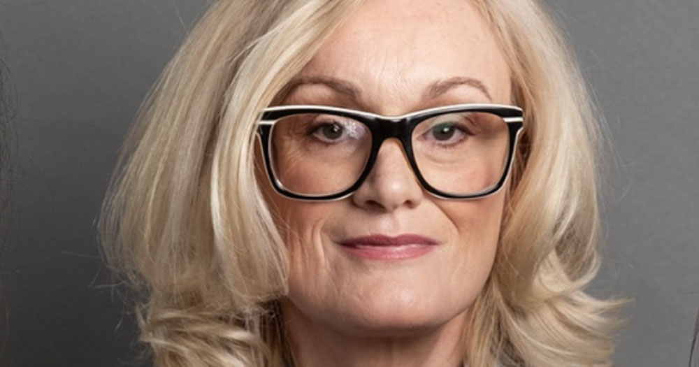 Close up of Senator Keogan wearing glasses with her blonge hair down