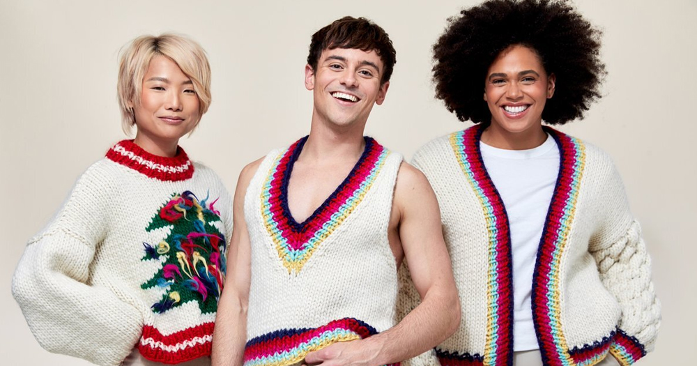 Tom Daley along with two models are modelling his knitted jumpers that are part of his 'Made With Love' collection available in John Lewis.