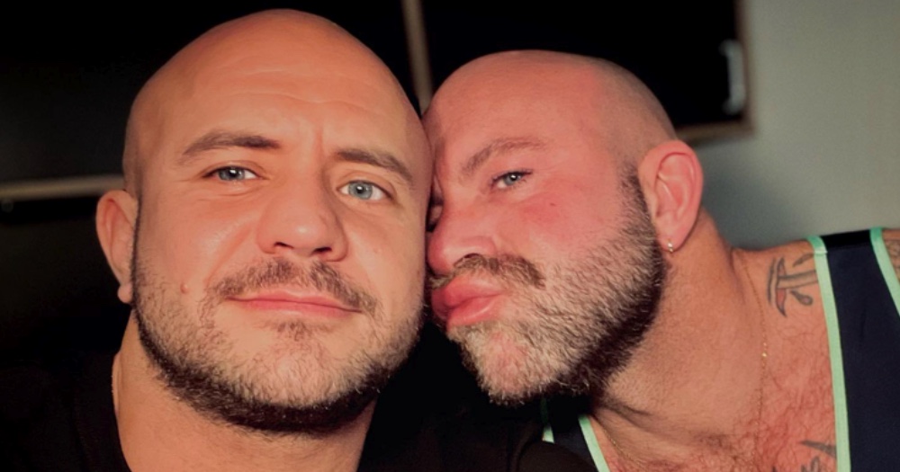 Performers Phil and Mr. James take a selfie, Mr. James making a kissy face at his boyfriend