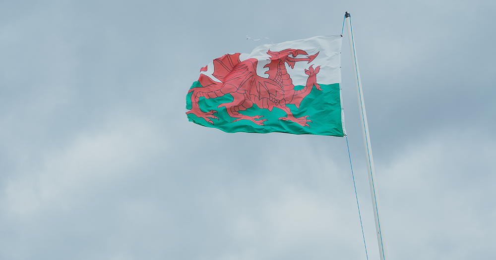 The Wales flag blowing in the wind as the country updates on its conversion therapy ban.