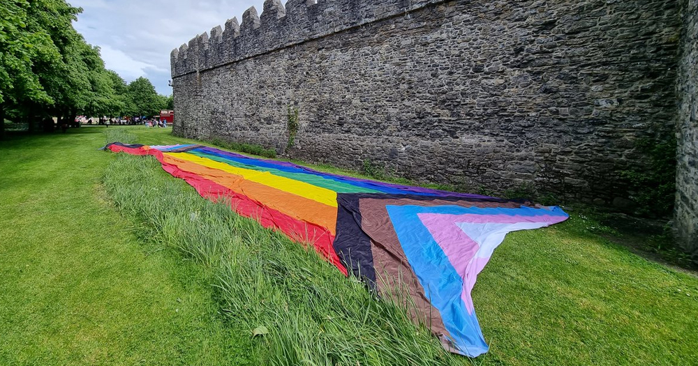 A Pride flag in the garden at Swords castle for Fingal Pride.