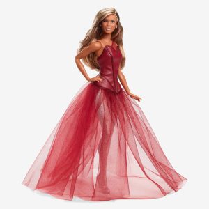 Barbie doll of Laverne Cox wearing red gown.
