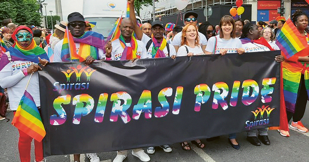 Photograph of the Spirasi group marching in a Pride parade.