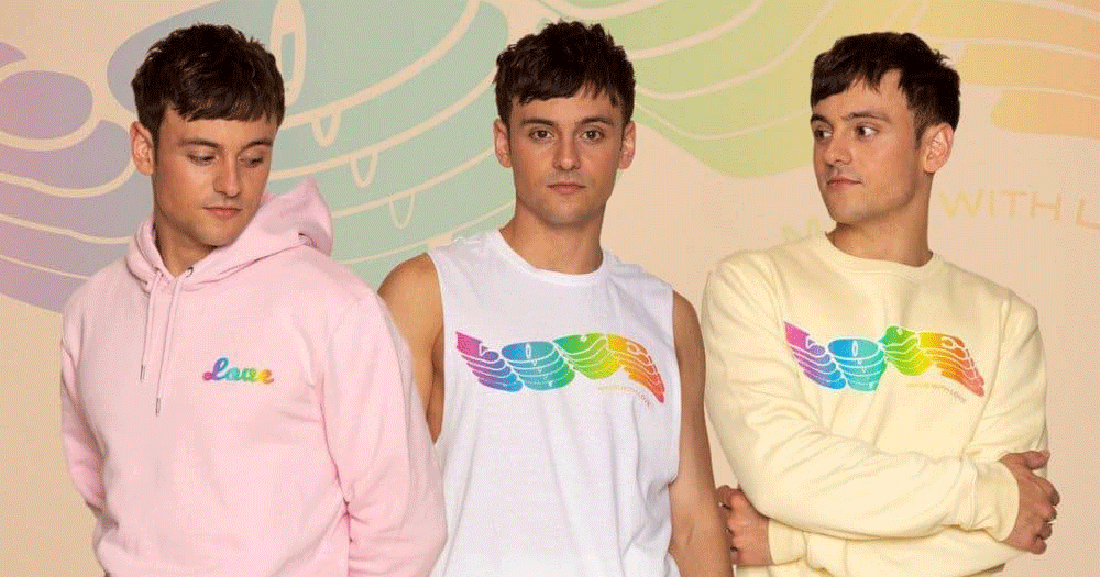 Photo of Tom Daley wearing three different pieces from his new Pride collection.