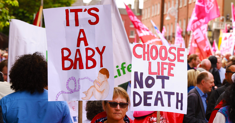 Anti-choice marchers in Dublin hold banners