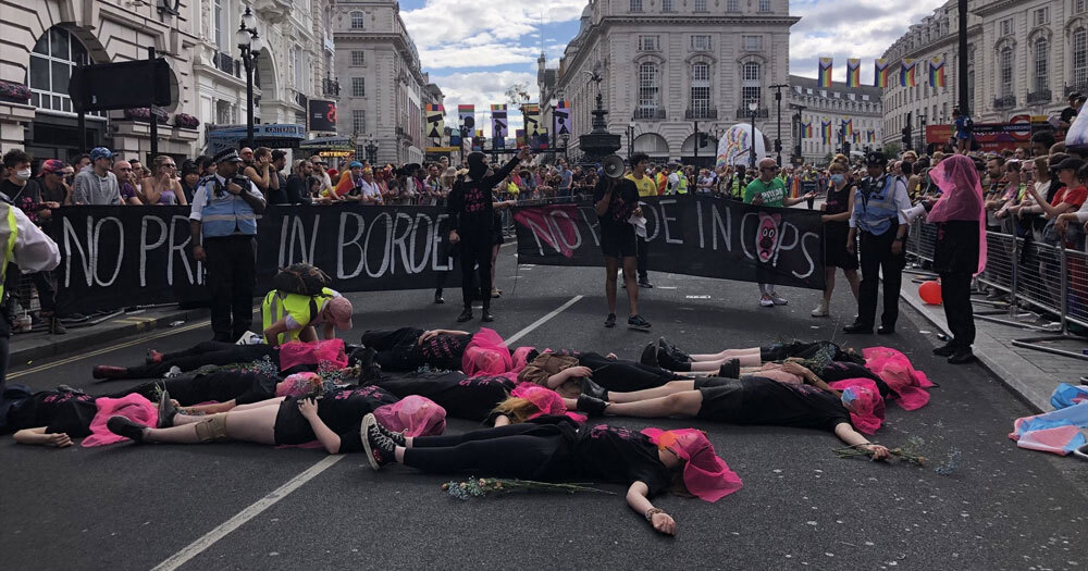LGBTQ+ activists staging a die-in at London Pride to protest the presence of police at the parade. They were lying on the ground dressed in all black and wearing pink veils.