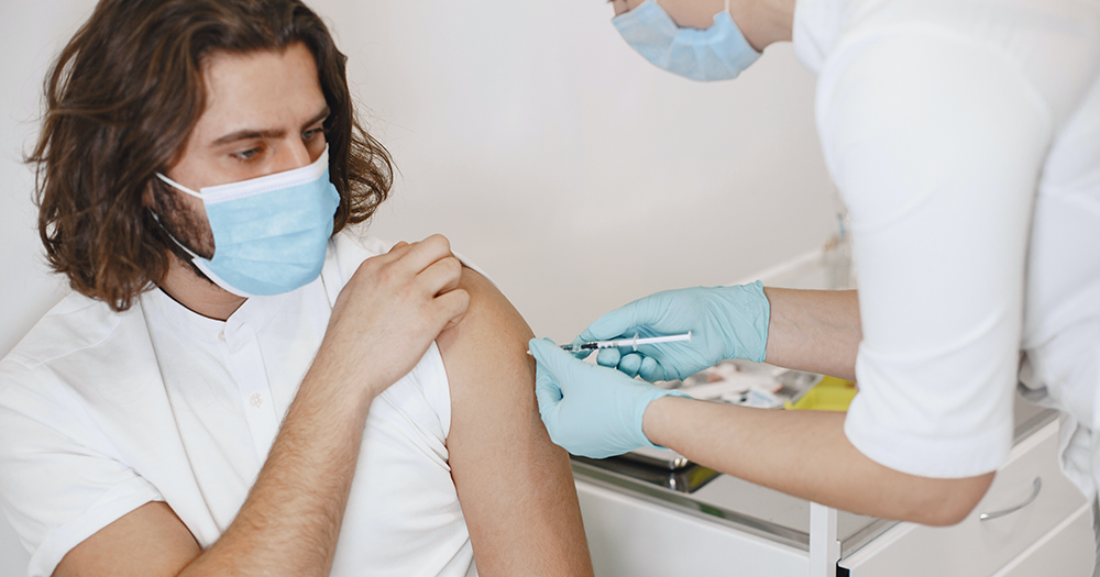 A man receiving a smallpox vaccine.