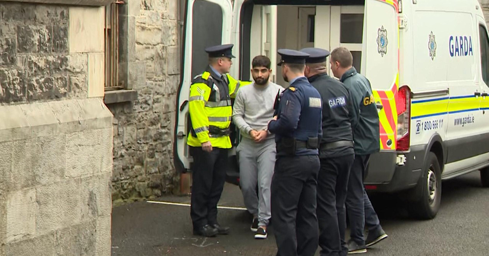 Yousef Palani, who has been remanded in custody, being escorted by Gardaí.