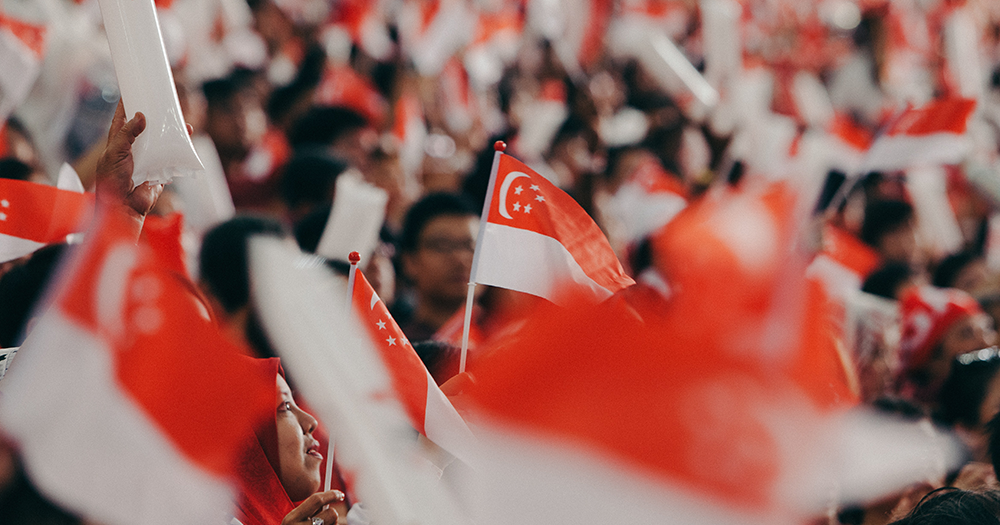 A crowd of Singapore flags.