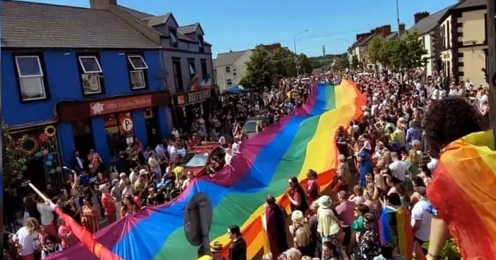 A picture of people holding a huge Pride flag in Sligo. This week Sligo Pride has organised many events for Pride.