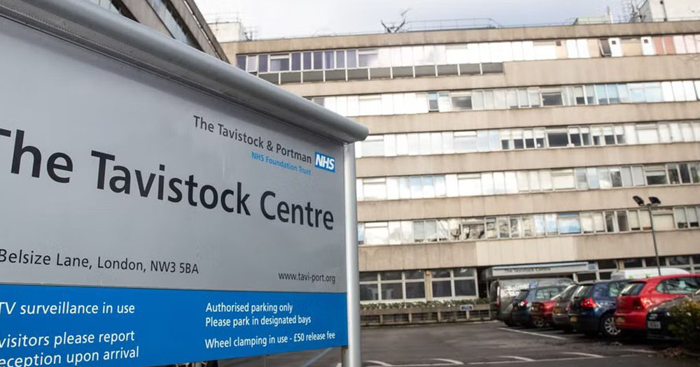 The photograph shows the sign for the Tavistock Centre, the clinic that provides Gender Identity Development Services.