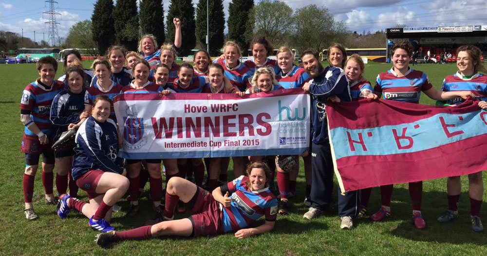 Photograph of Hove English women's rugby team after they winning a cup.