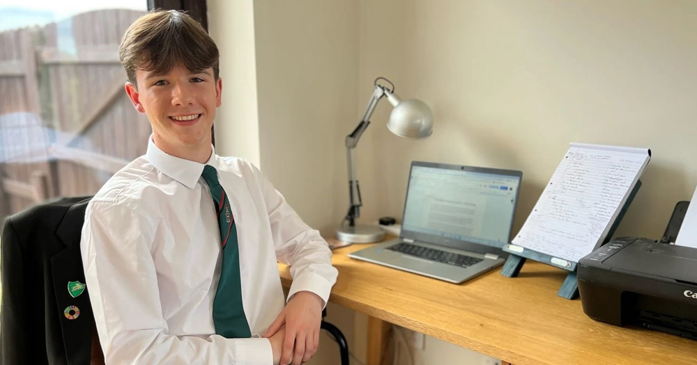 UNICEF Louth teenager and youth advocate Ruairi Holohan sitting at his desk at home in Dundalk.