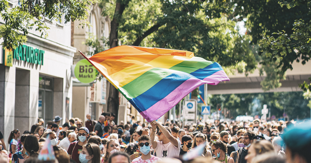 October is LGBTQ+ history month. In the picture, a Pride flag in a protest.