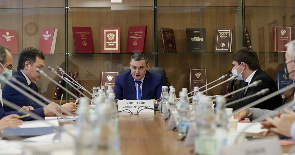 Russian lawmakers including Russian MP Alexander Khinshtein sit around table. This week, Russian Parliament proposed a new law that would criminalise the publication of LGBTQ+ ‘propaganda’ content online.