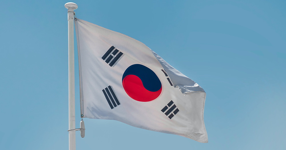 Flag of South Korea against a blue sky.